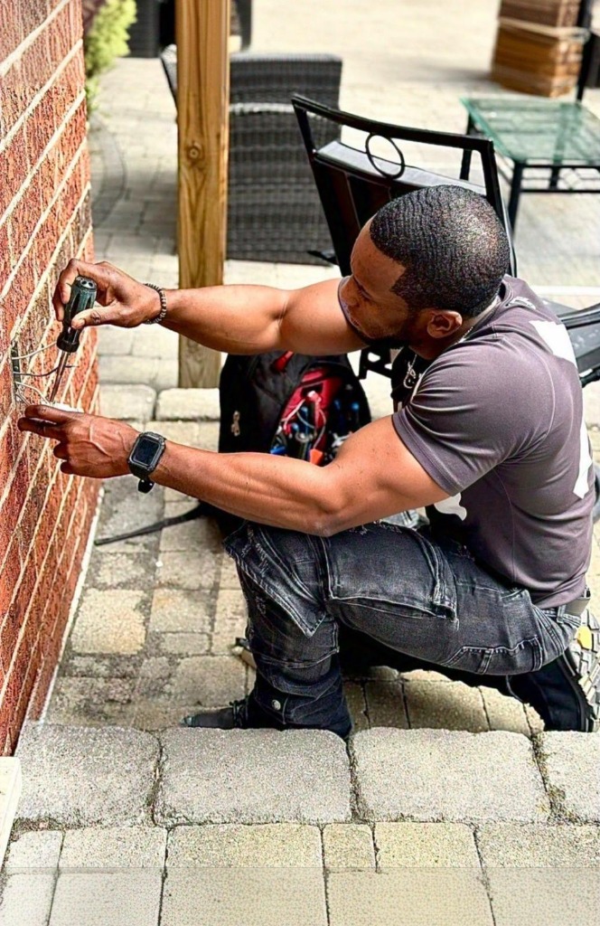 Electrician troubleshooting outdoor outlet
